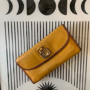 L Dooney Bourke wallet dark yellow with brown
